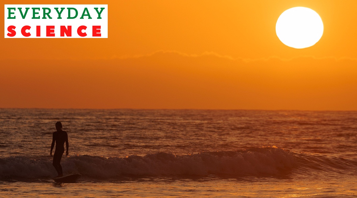 A surfer catches one of the last waves of the day as the sun sets on the summer solstice marking the longest day in the Northern Hemisphere, off Cardiff State Beach in Encinitas, California, U.S., June 21, 2023.