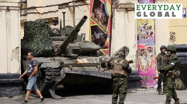 Russian servicemen guard an area standing in front of a tank in a street in Rostov-on-Don, Russia, Saturday, June 24, 2023.