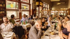 People dine at Miramar, an iconic restaurant in the working-class neighborhood of San Cristóbal, in Buenos Aires, Argentina, June 8, 2023. Argentina’s financial crisis has a surprising side effect: a flourishing dining scene in Buenos Aires, as residents rush to spend pesos before they lose more value. (Sarah Pabst/The New York Times)