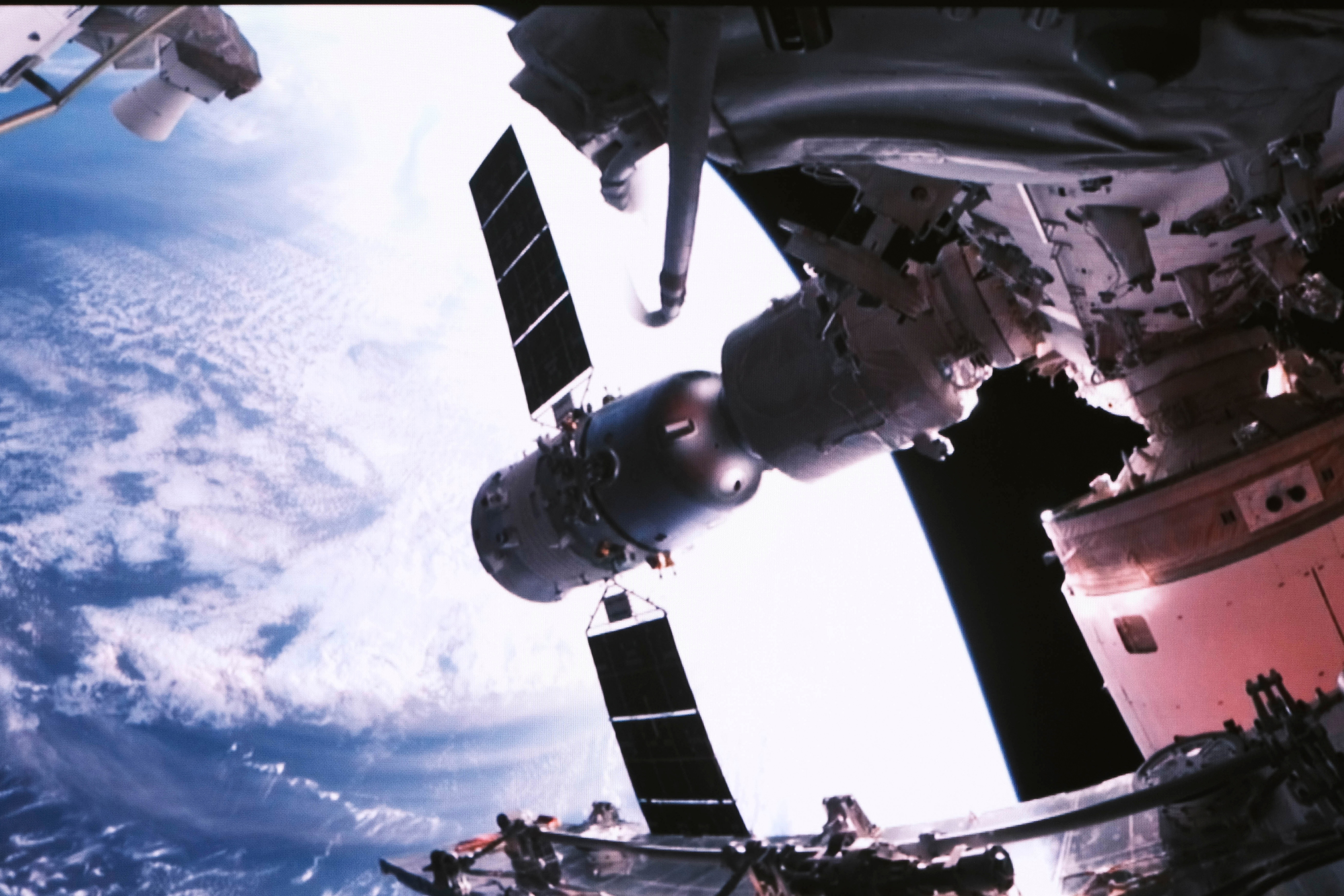 This photo released by Xinhua News Agency shows a screen image captured at Beijing Aerospace Control Center on May 30, 2023 of the Shenzhou-16 crewed spaceship successfully docking with the radial port of core module Tianhe of the Chinese space station. China launched a new three-person crew for its orbiting space station on Tuesday, with an eye to putting astronauts on the moon before the end of the decade. (Li Jie/Xinhua via AP)