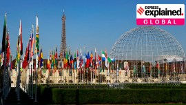 The Eiffel Tower, country flags and the Dome are seen from the garden of the United Nations Educational, Scientific and Cultural Organisation (UNESCO) headquarters building during the 39th session of the General Conference at the UNESCO headquarters in Paris.