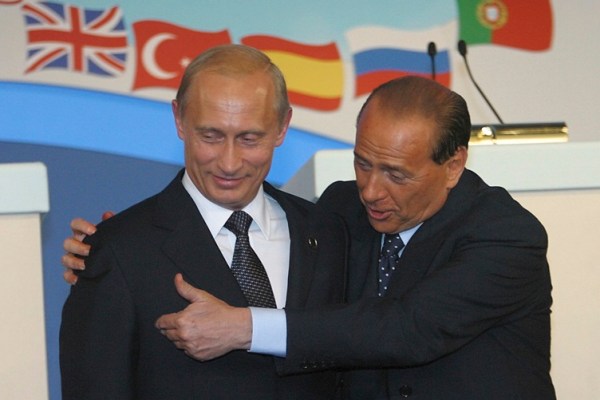 Russian President Vladimir Putin, left, and Italy's Prime Minister Silvio Berlusconi at the NATO Russia summit in the Pratica di Mare Italian Air Force base on the outskirts of Rome, on May 28, 2002. 