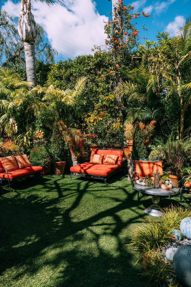 A lawn of leisure and privacy at the hedge-ensconced home of Brent Green, a veteran landscaper whose clients include Regina King, Regina Hall and Sharon and Ozzy Osbourne, at his own hedge-ensconced home in Los Angeles, March 23, 2023. (Tanveer Badal/The New York Times)