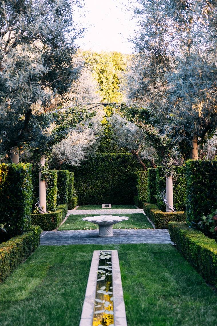 Walls within walls of hedges in the Beverly Hills backyard of Andrea and Carlos Alberini, in Los Angeles, March 24, 2023. (Tanveer Badal/The New York Times)