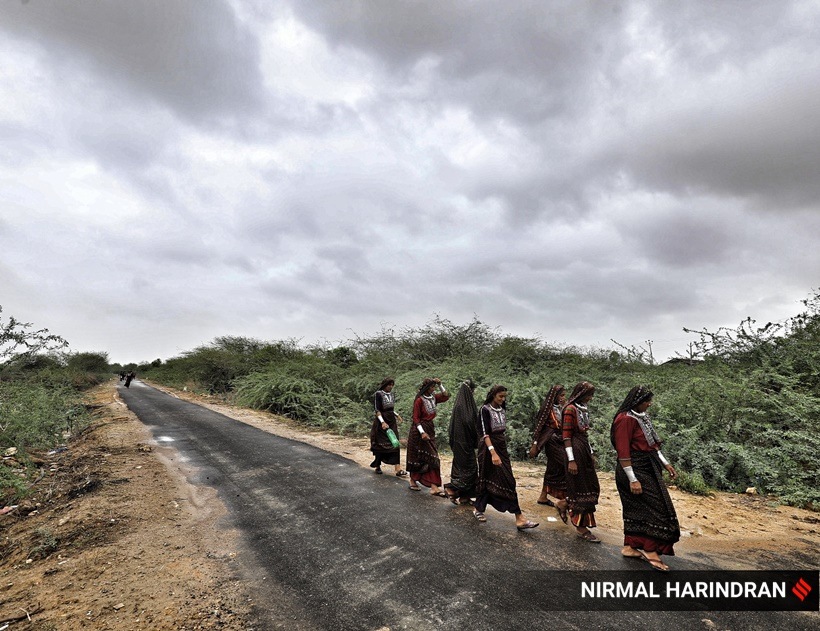 Women walking back to a cyclone shelter