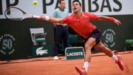 Novak Djokovic plays a shot during the French Open