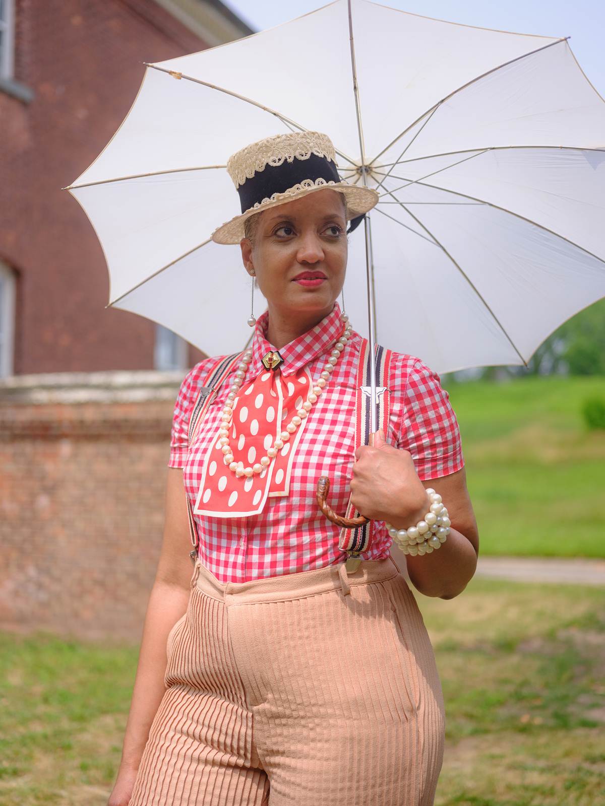 Inez Robinson, an educator, attends the Jazz Age Lawn Party on Governors Island in New York, June 11, 2023. (Desiree Rios/The New York Times)