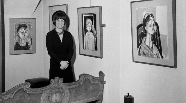 Artist Francois Gilot poses with her work at a personal art exhibition in Milan, Dec. 21, 1965. (AP Photo, File)