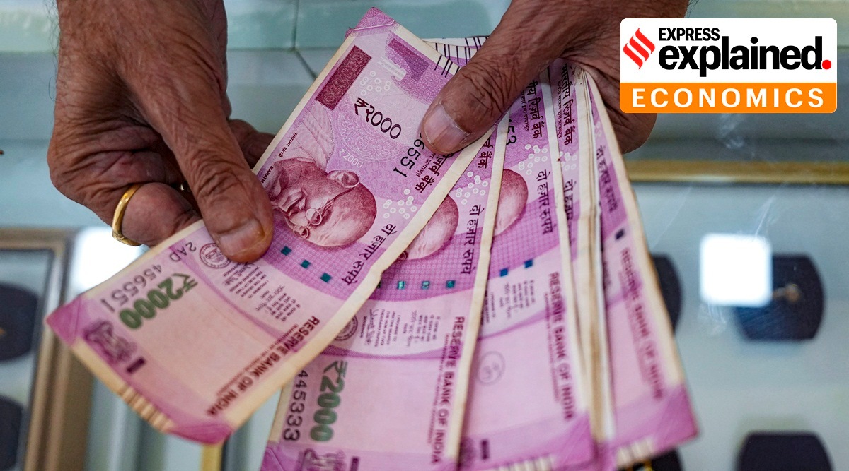 A shopkeeper counts Rs 2,000 rupee currency notes at a jewellery shop in Mumbai, Tuesday, May 23, 2023.