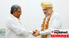 Karnataka chief minister Siddaramaiah shaking hands with home minister Amit Shah.