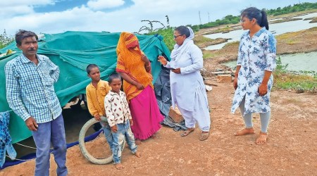 A district administration official with one of the pregnant women in Devbhumi Dwarka. Express