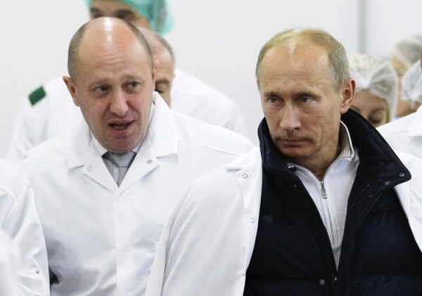 Businessman Yevgeny Prigozhin, left, shows Russian President Vladimir Putin, around his factory which produces school meals, outside St. Petersburg, Russia on Monday, Sept. 20, 2010. 