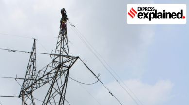 A worker atop a cable tower.