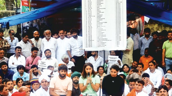 Wrestlers Bajrang Punia, Vinesh Phogat and Sakshi Malik during a press conference at Jantar Mantar in new Delhi. Express photo by Prem Nath Pandey