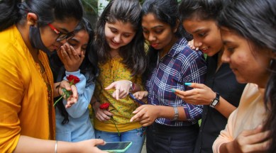 NIOS students checking the results on the phone