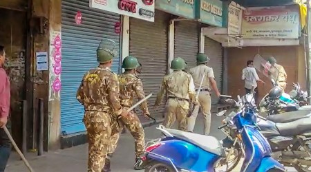 Security personnel attempt to disperse agitators objecting to the alleged use of Tipu Sultan's image along with an objectionable audio message as social media status by some locals, in Kolhapur district, June 7, 2023. (PTI)