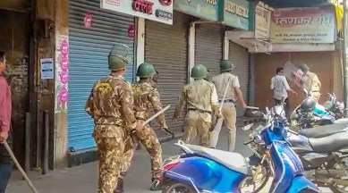 Security personnel attempt to disperse agitators objecting to the alleged use of Tipu Sultan's image along with an objectionable audio message as social media status by some locals, in Kolhapur district, June 7, 2023. (PTI)