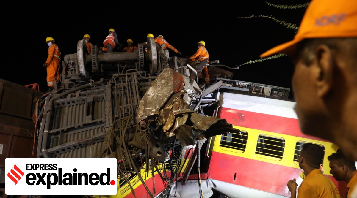 NDRF personnel working at night, under emergency lights on top of a pile of bogies, and using gas cutter to rescue people, dead or alive, in the Bahanaga village of Balasore district in Odisha.