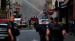 French police secure the area as firefighters work after several buildings on fire following a gas explosion in the fifth arrondissement of Paris, France, June 21, 2023. REUTERS