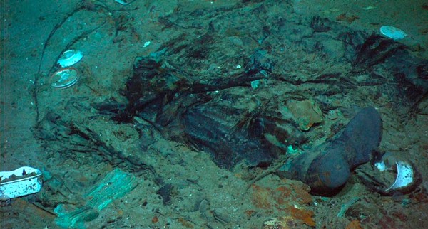 This 2004 photo provided by the Institute for Exploration, Center for Archaeological Oceanography/University of Rhode Island/NOAA Office of Ocean Exploration, shows the remains of a coat and boots in the mud on the sea bed near the Titanic's stern. 