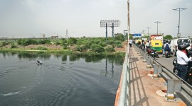 A rescue team scans the Yamuna at DND flyover, where the man jumped into the river Wednesday. Tashi Tobgyal