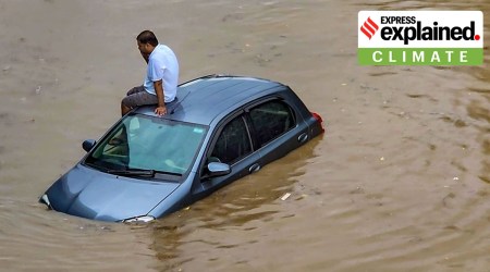 A stranded commuter at Subhash Chowk in Gurgaon, Sunday. PTI