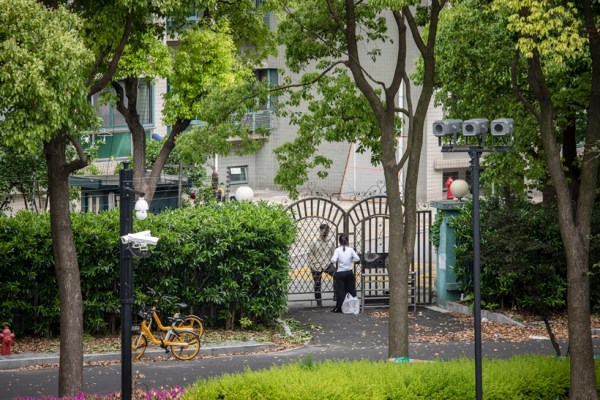 A conversation through a gate during Covid-19 lockdowns in Shanghai, China, April 25, 2022. 