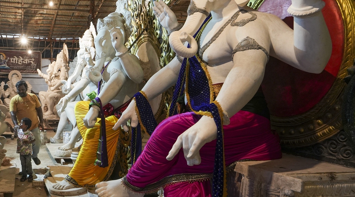 Idols of Lord Ganesh are being readied at a workshop ahead of the Ganesh Chaturthi festival, in Mumbai, Sunday. PTI