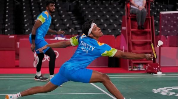 India's Satwiksairaj Rankireddy and Chirag Shetty, right, compete against Taiwan's Lee Yang and Wang Chi Lin during their men's doubles group stage badminton match at the 2020 Summer Olympics. 