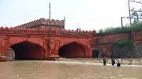 Thursday afternoon, water from the overflowing Yamuna inundates Ring Road at Red Fort. ANI