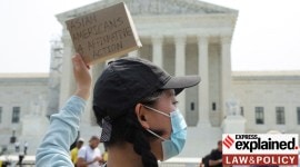 Asian-American supporter of affirmative action policies protests outside the U.S. Supreme Court, in Washington US SC limits affirmative action in college