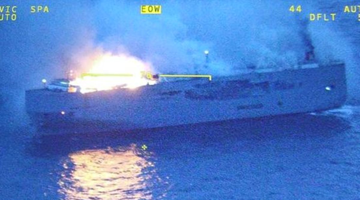 A fire is still burning on board a car-carrying cargo ship near a ...