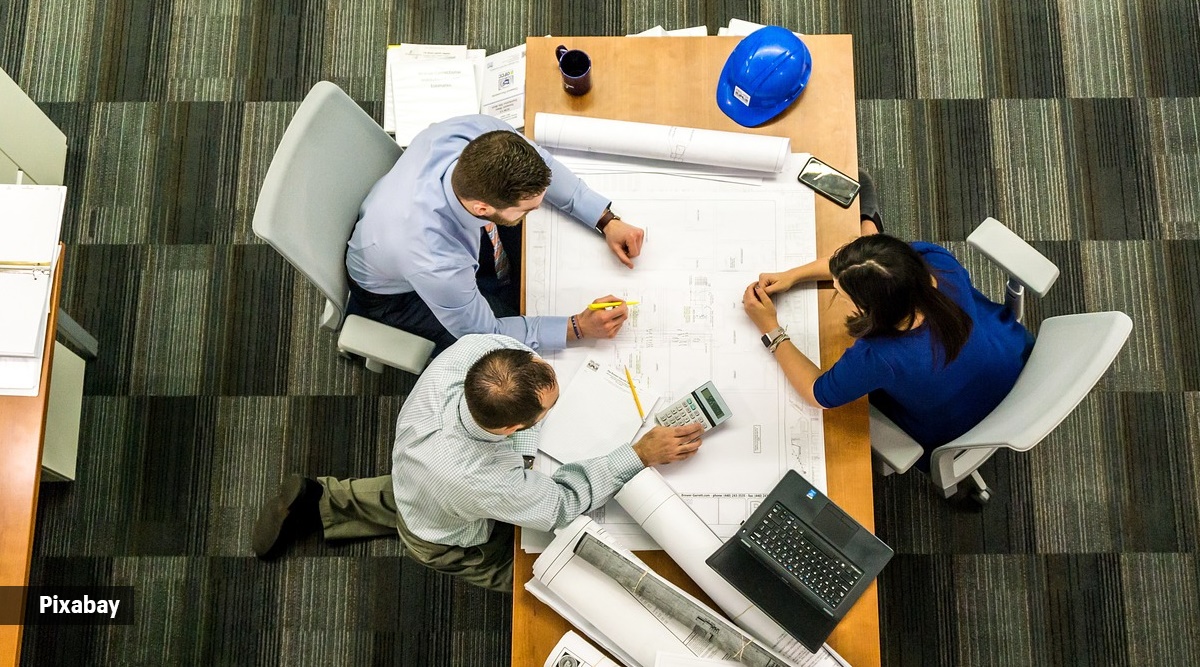 Workers hate office noise – but is using headphones to shut out colleagues the solution?