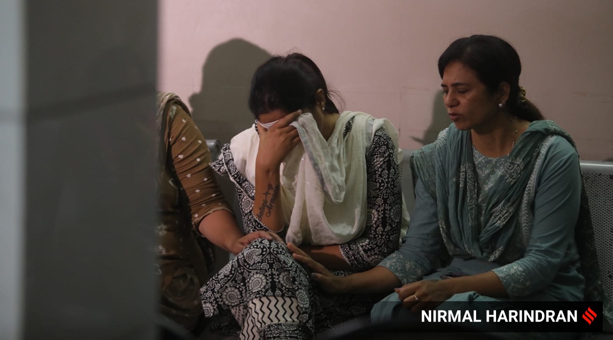 Relatives of the victims of Iskcon flyover accident at Sola Civil Hospital in Ahmedabad. (Express photo by Nirmal Harindran)