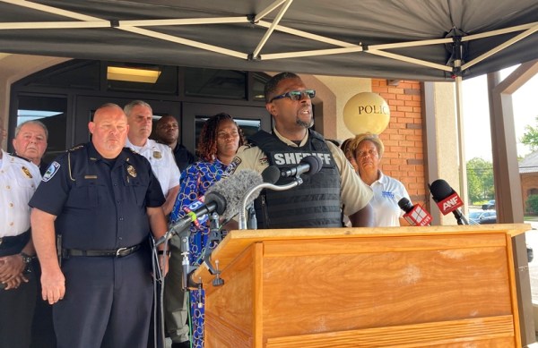 Henry Reginald Scandrite County Sheriff speaks July 16, 2022, in Hampton, Georgia, while surrounded by other police and local officials.  (AP)