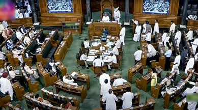 Opposition MPs raise slogans in the Lok Sabha during the Monsoon Session of Parliament