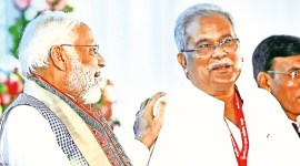 PM Narendra Modi with Chhattisgarh CM Bhupesh Baghel in Raipur, Friday. PTI