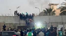 Protesters scale a wall at the Swedish Embassy in Baghdad, July 20, 2023