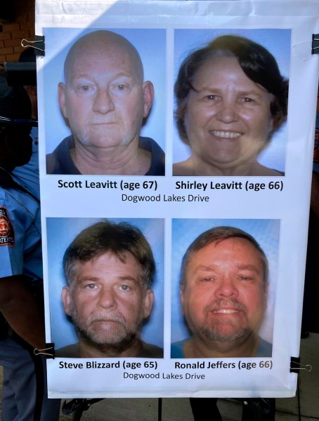 Photos identifying the four people killed in the shooting Saturday near Atlanta are shown by officers, Sunday, July 16, 2023, in Hampton, Georgia. (AP Photo/Jeff Amy)