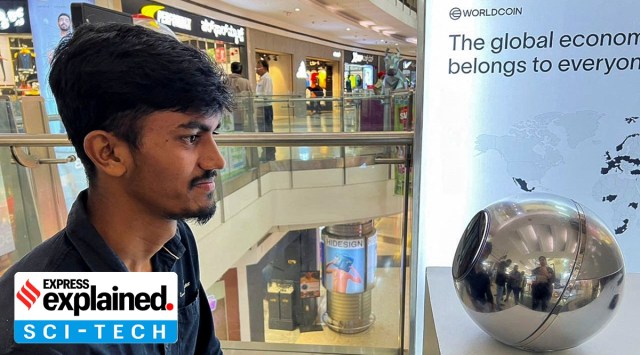A man in Bengaluru, signs up for WorldCoin by having his eyes scanned by the spherical device in Mantri Square Mall in Bengaluru, India July 25, 2023.