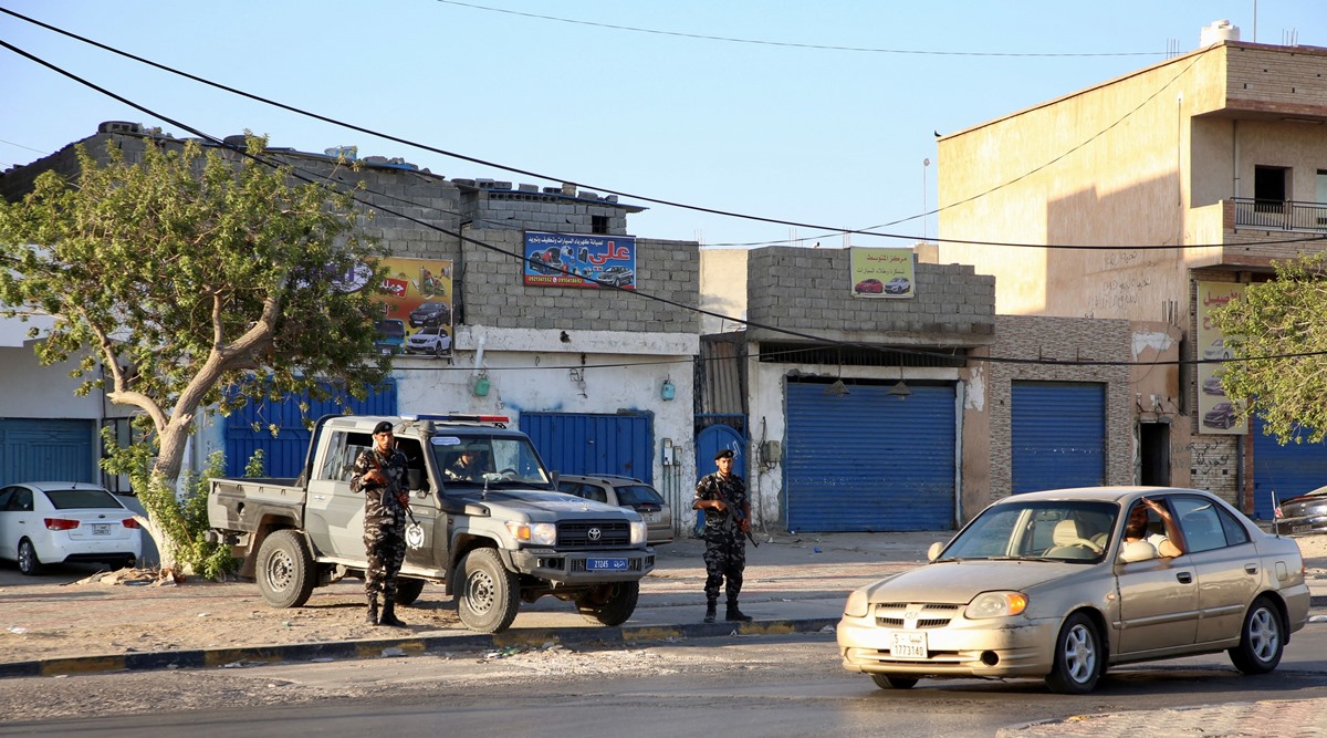 Members of the Security personnel affiliated with the Ministry of Interior secure the streets after yesterday's clashes between armed factions in Tripoli