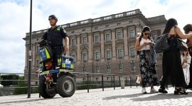 Police officer on a Segway patrols Sweden's parliament in Stockholm