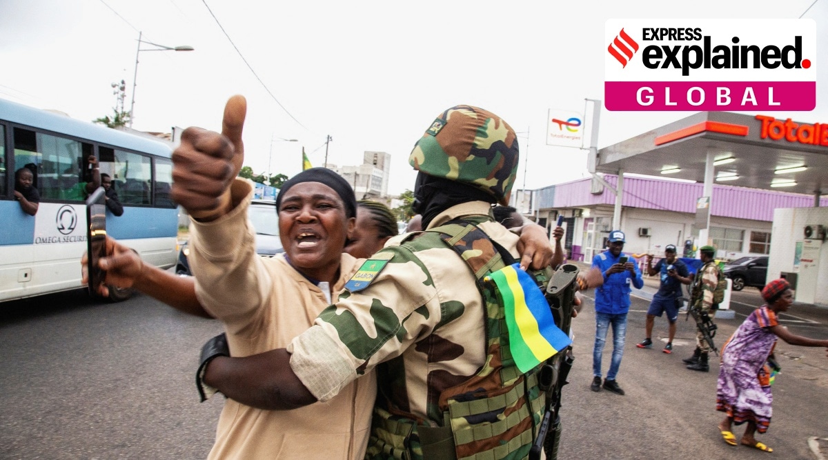 A woman embraces a soldier as she celebrates with people in support of a putschists, in a street of Port-Gentil, Gabon August 30, 2023.