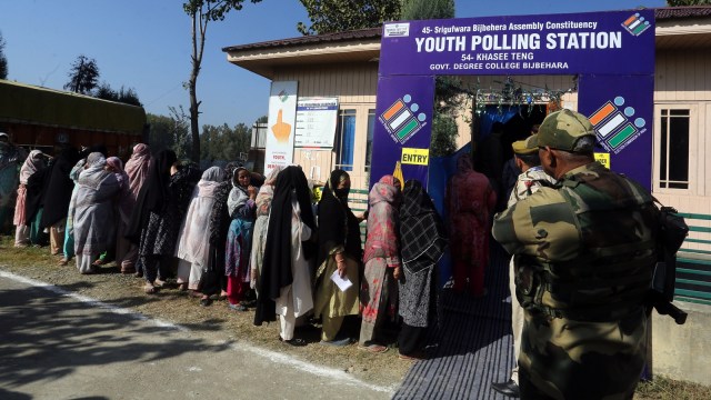 A queue outside a polling station at Bijbehara in Anantnag district during the first phase of Assembly elections in Jammu and Kashmir on Wednesday. (Express photo by Shuaib Masoodi)