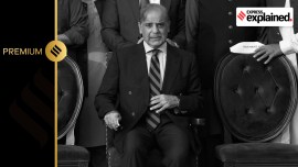 Pakistan's Prime Minister Shehbaz Sharif waits for a group photo with lawmakers of the National Assembly at the end of the last session of the outgoing parliament, in Islamabad, Pakistan, Wednesday, Aug. 9, 2023.