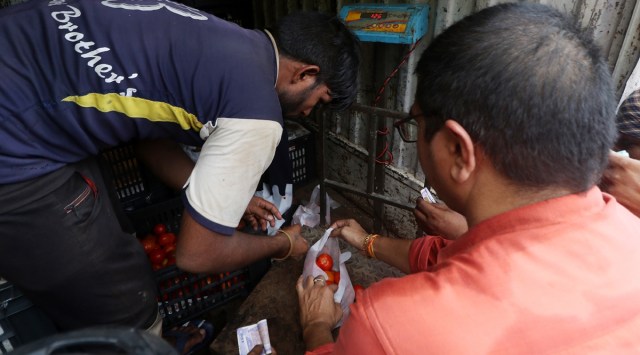 People purchase subsidised tomatoes in Lucknow. File