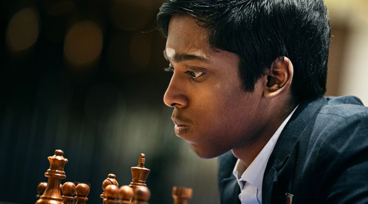 Premium Photo  Two young man are playing chess