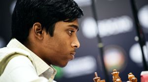 Praggnanandhaa springs a surprise opening, but Magnus Carlsen fights back  to wrestle a draw in Round One