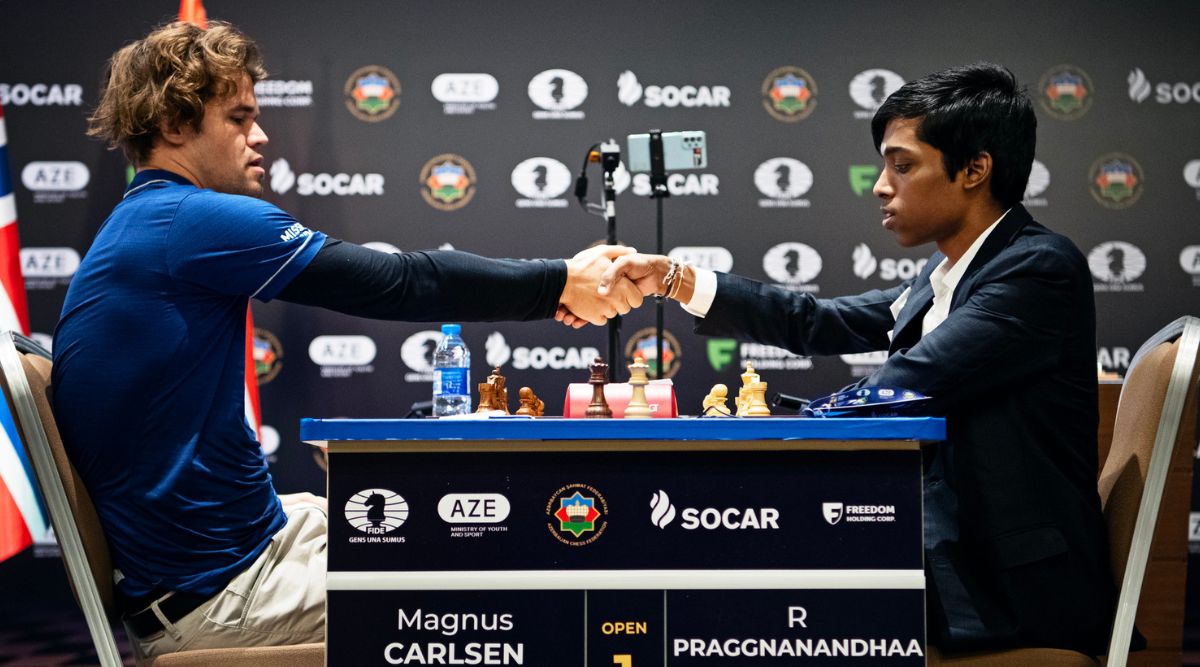 Praggnanandhaa springs a surprise opening, but Magnus Carlsen fights back  to wrestle a draw in Round One