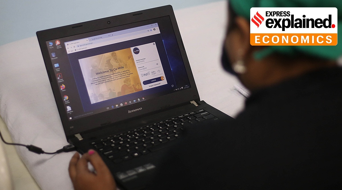 A healthworker checking out the Co-Win Application on a laptop.